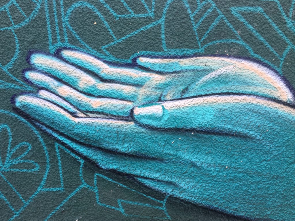 Wall mural image of two open hands